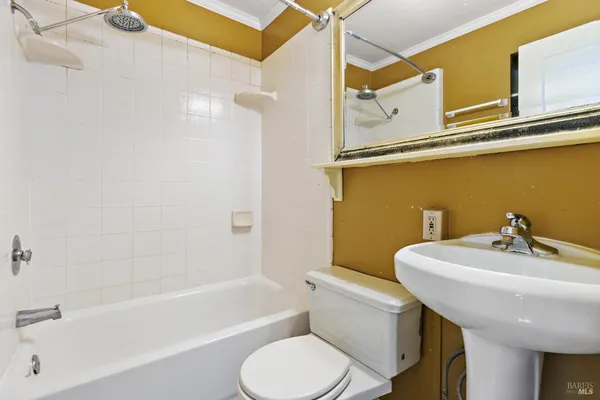 a bathroom with a sink a toilet and bathtub