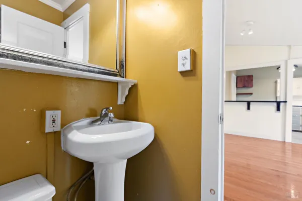 a bathroom with a sink and a mirror