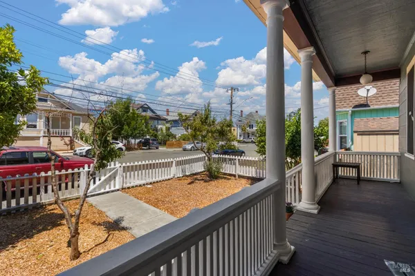 a view of a balcony with wooden floor