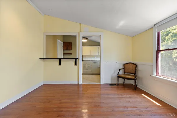 a view of a livingroom with furniture and window