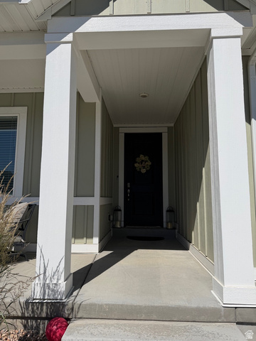 315 South Sherman Street Mapleton, UT 84664 - Photo 3 of 30 Covered entry with concrete flooring, recessed lighting, and a dark front door