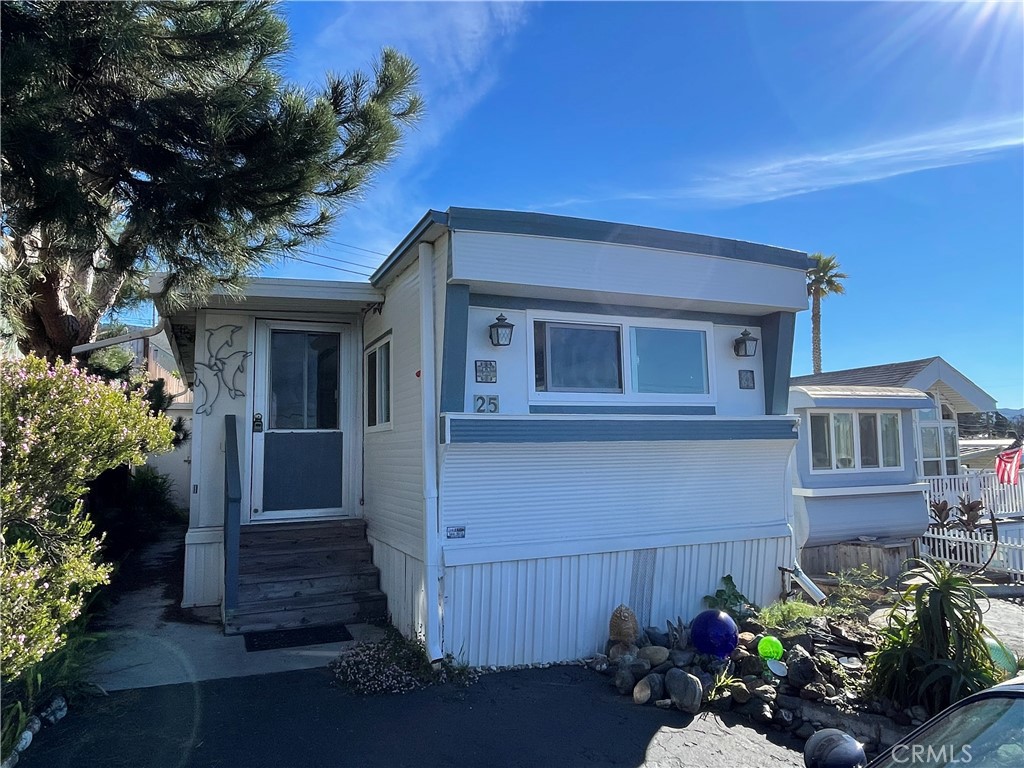 a view of a house with a flower garden