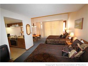 800 Copper Road, Unit 376 Copper Mountain, CO 80443 - Photo 2 of 6 a living room with furniture and a mirror
