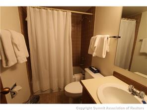 800 Copper Road, Unit 376 Copper Mountain, CO 80443 - Photo 4 of 6 a bathroom with a sink toilet and shower