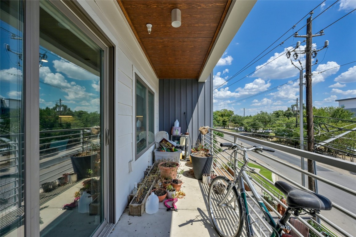 4361 South Congress Avenue, Unit 228 Austin, TX 78745 - Photo 17 of 20 a view of a porch with furniture and floor to ceiling window