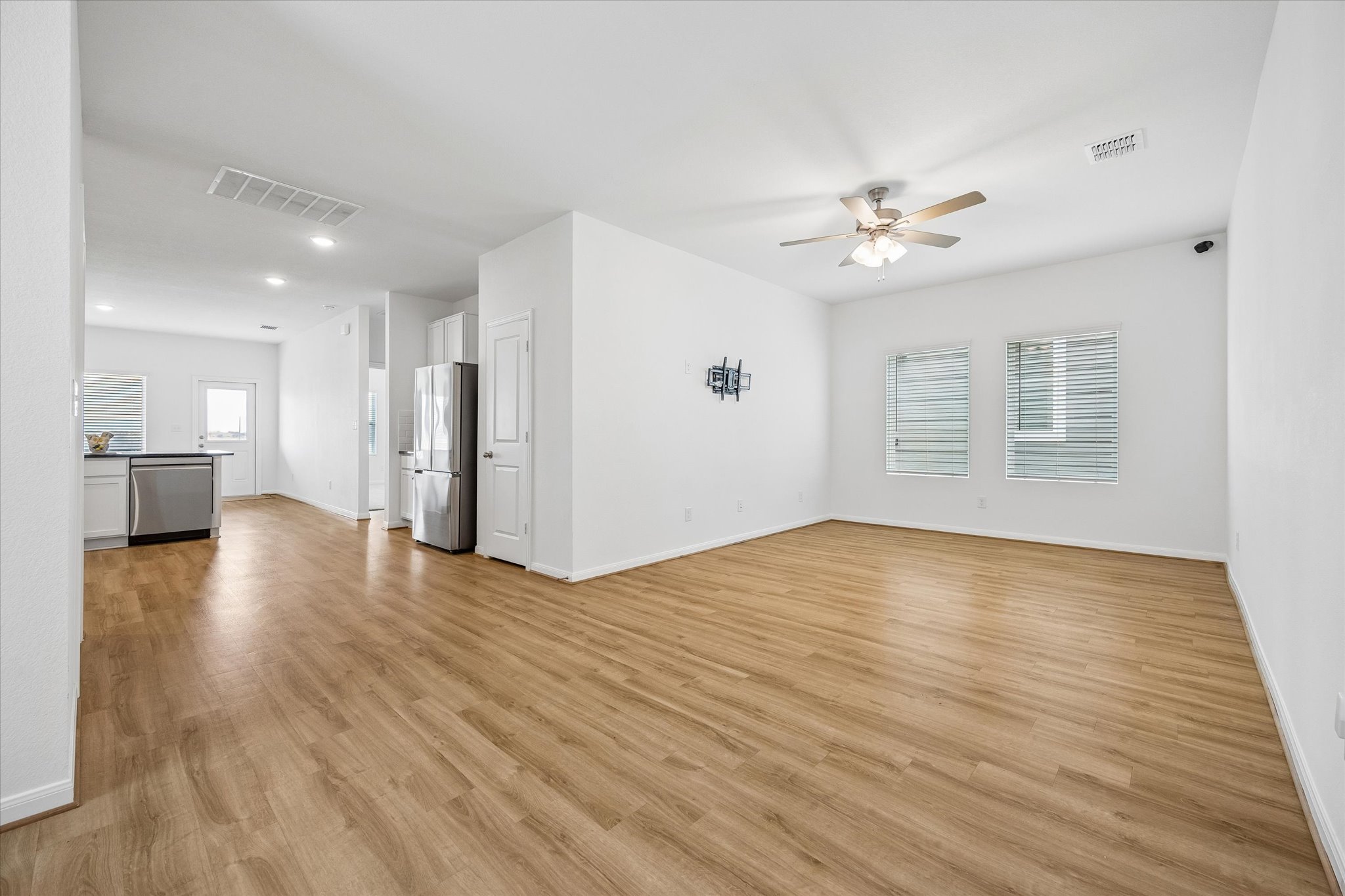 157 LT Rusty Drive Jarrell, TX 76537 - Photo 6 of 39 a view of empty room with wooden floor and ceiling fan