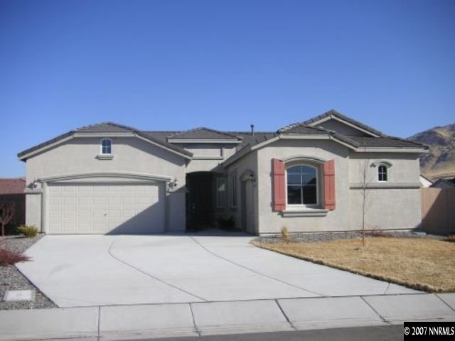 2545 7 Pines Court Reno, NV 89521 - Photo 1 of 5 a front view of a house with a garage