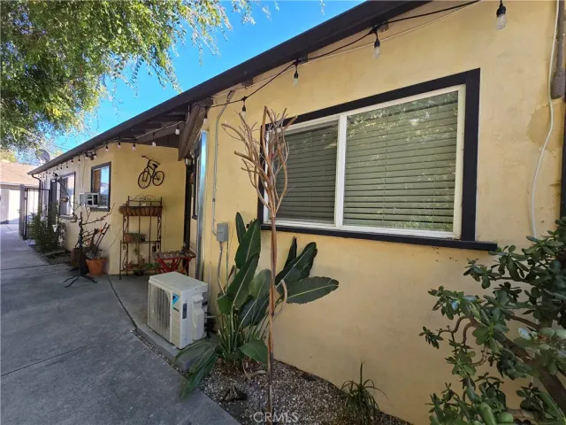 a view of a house with a potted plant