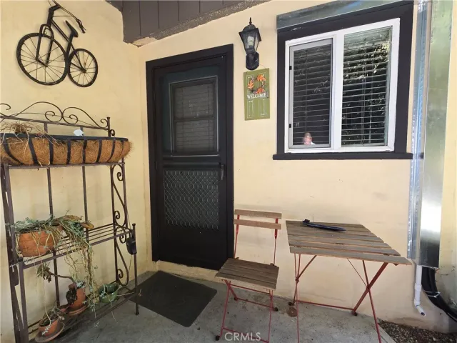 a view of entryway with a door and a chair