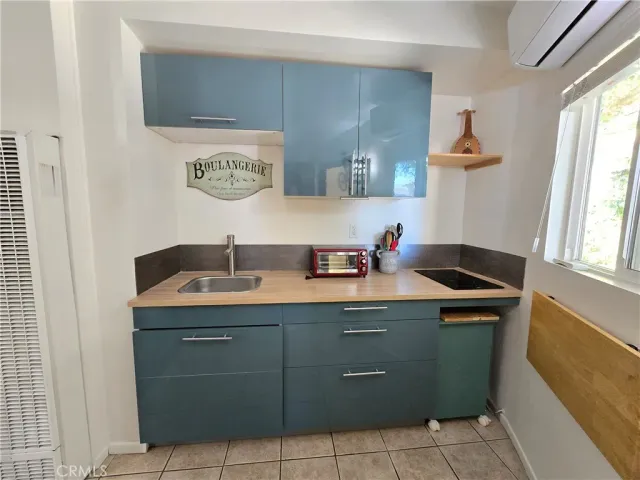 a room with a sink and a mirror