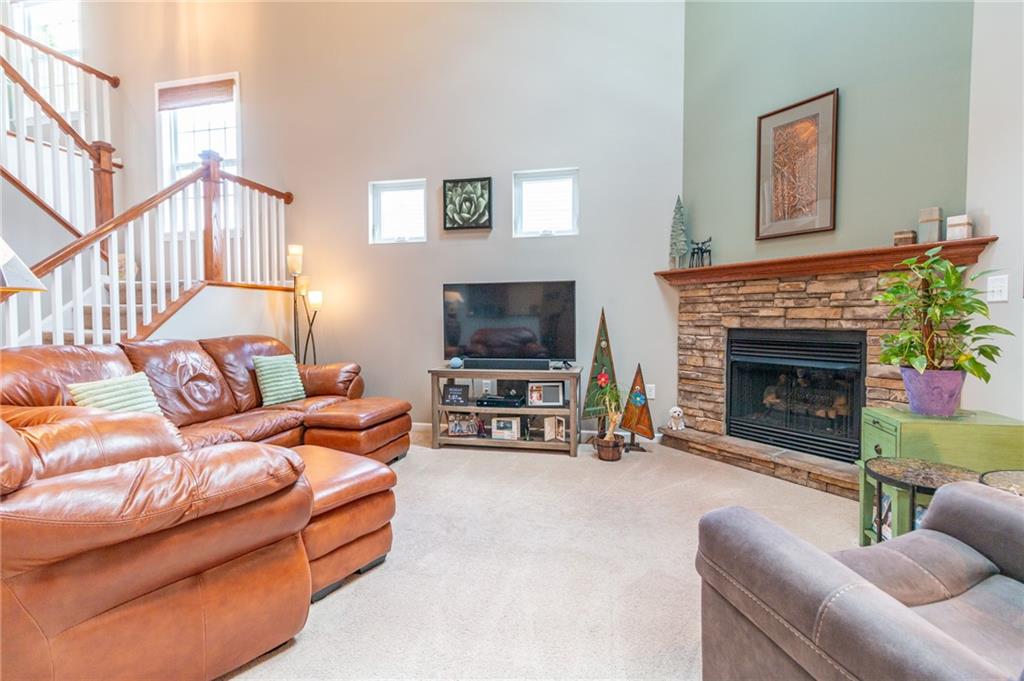 425 Chestnut Lane Apollo, PA 15613 - Photo 6 of 48 a living room with furniture and a fireplace