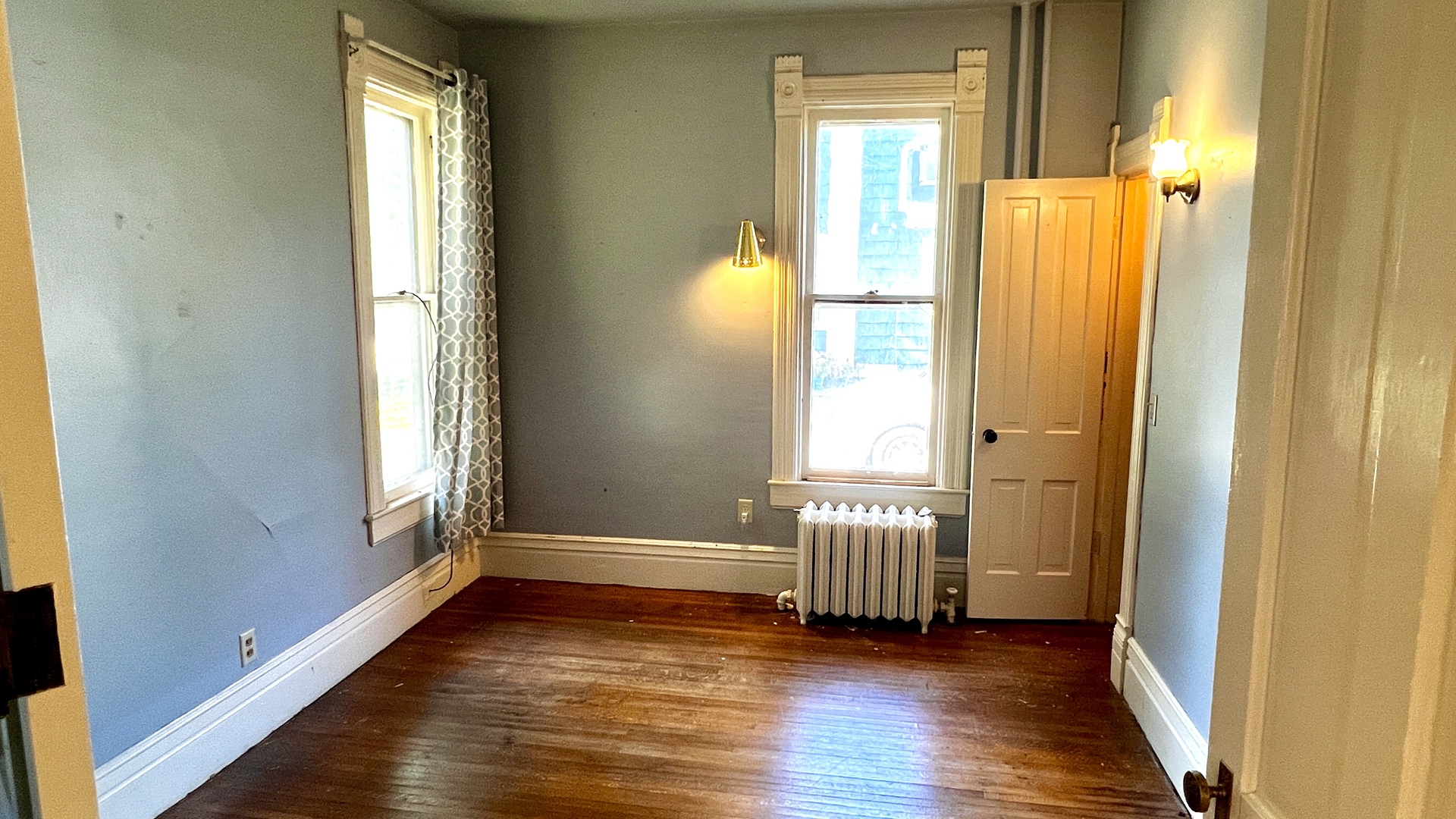 406 South Genesee Street Morrison, IL 61270 - Photo 12 of 34 an empty room with wooden floor and windows