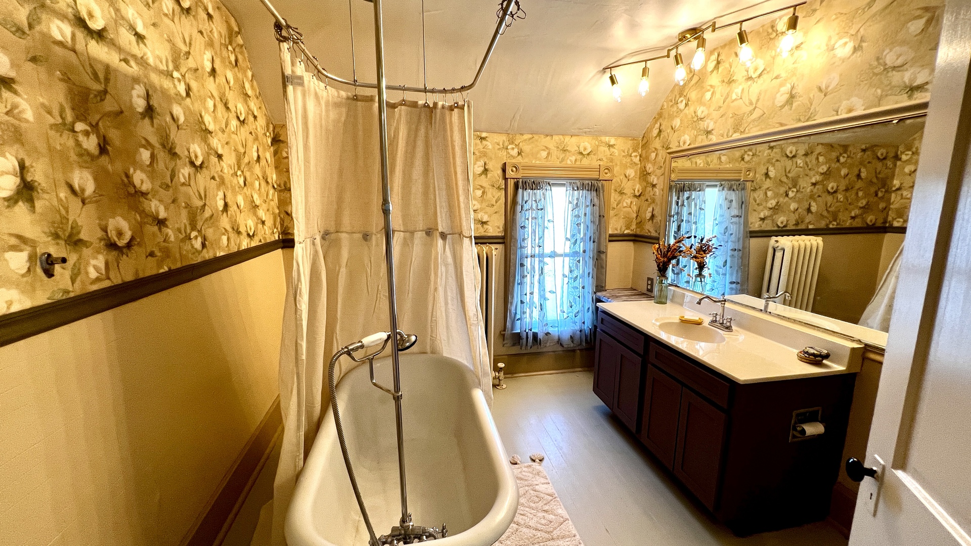 406 South Genesee Street Morrison, IL 61270 - Photo 14 of 34 a bathroom with a sink and mirror with bathtub