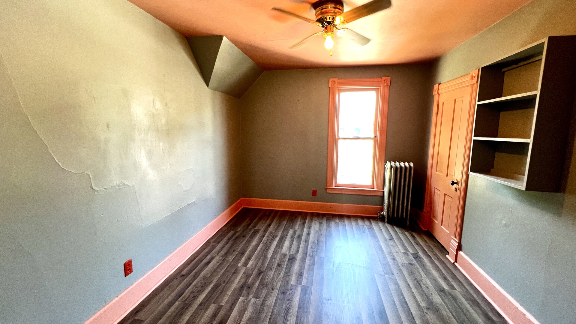 406 South Genesee Street Morrison, IL 61270 - Photo 17 of 34 a view of empty room with wooden floor and fan