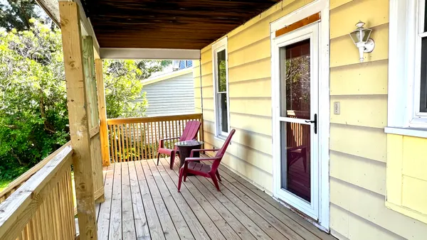 a view of a porch with furniture