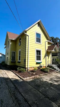a front view of a house with yard