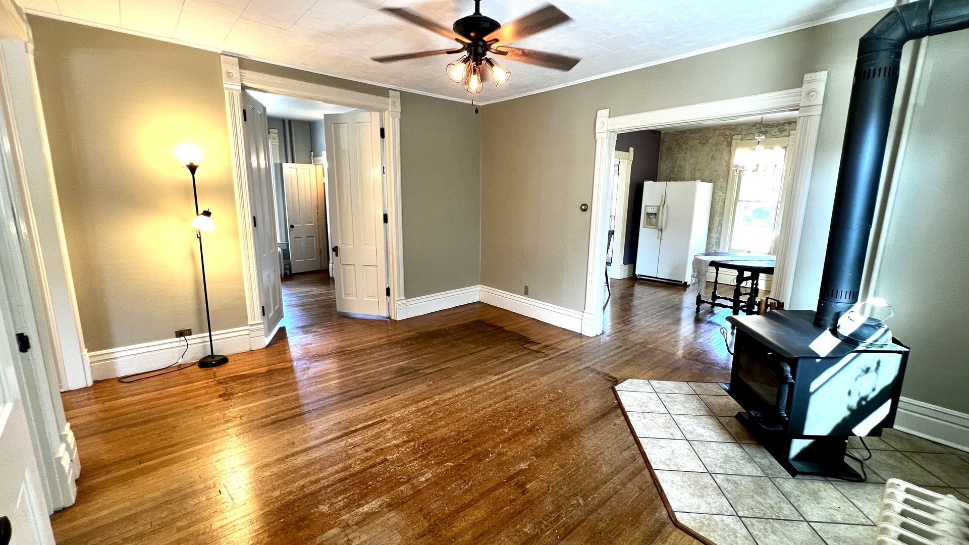 406 South Genesee Street Morrison, IL 61270 - Photo 7 of 34 a living room with furniture a dining table and wooden floor