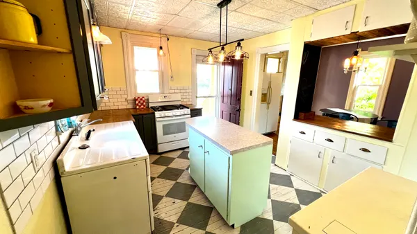 a view of a kitchen with appliances and a window