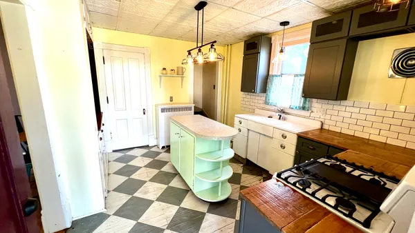 a bathroom with a sink mirror and toilet