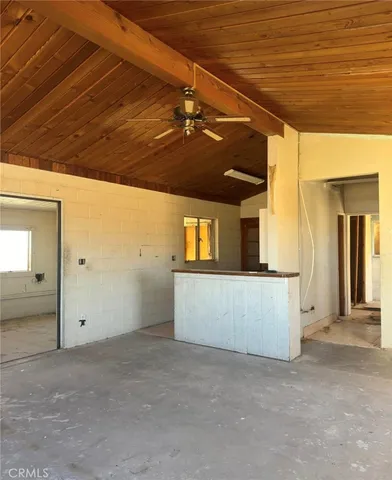 a view of a room with a ceiling fan