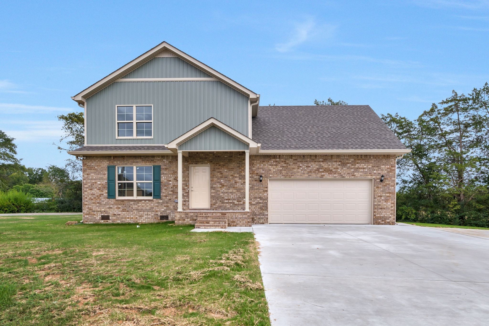 383 Doak Road, Unit 40 Manchester, TN 37355 - Photo 1 of 32 a front view of a house with garden