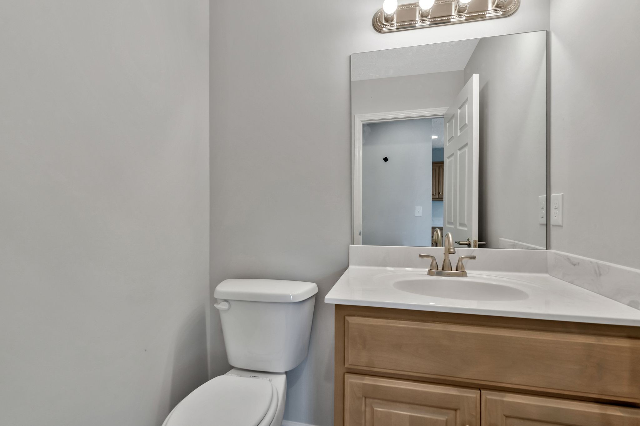 383 Doak Road, Unit 40 Manchester, TN 37355 - Photo 14 of 32 a bathroom with a toilet sink and mirror