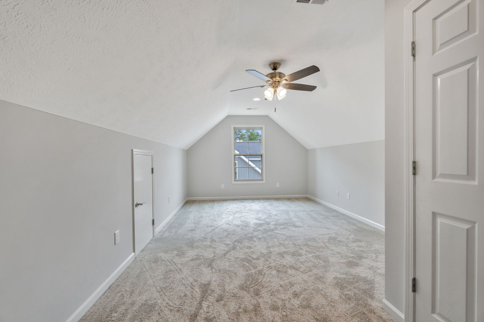 383 Doak Road, Unit 40 Manchester, TN 37355 - Photo 24 of 32 an empty room with chandelier fan and windows