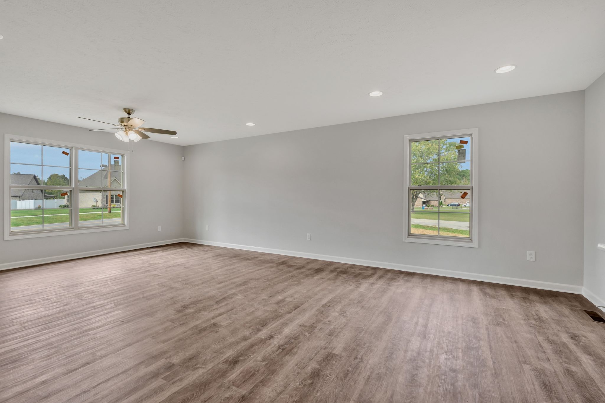 383 Doak Road, Unit 40 Manchester, TN 37355 - Photo 7 of 32 a view of an empty room with a window and wooden floor