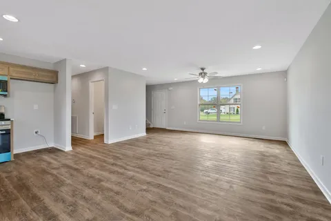a view of an empty room and a window