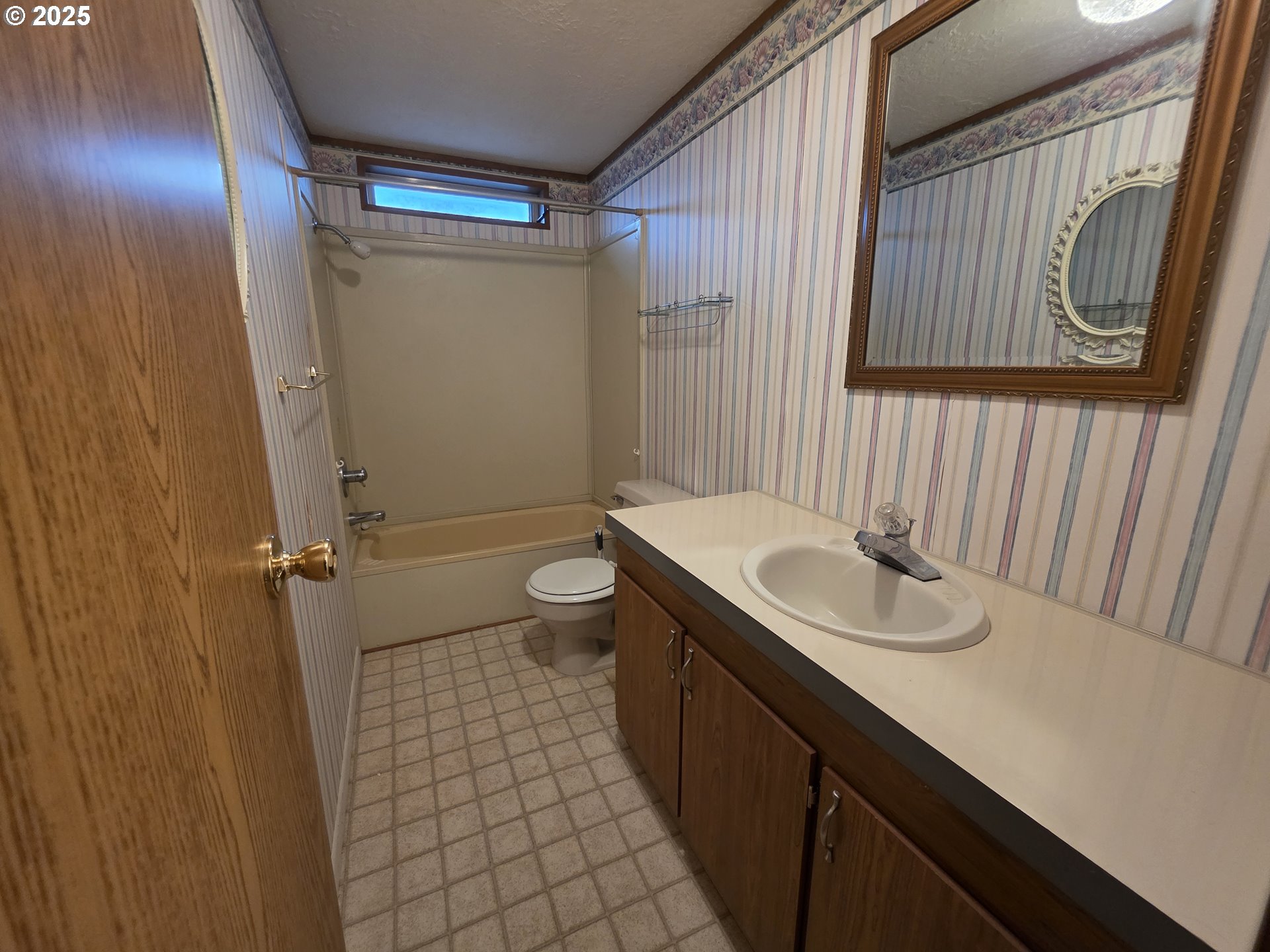 1506 Pioneer Circle Forest Grove, OR 97116 - Photo 20 of 28 a bathroom with a sink and a mirror