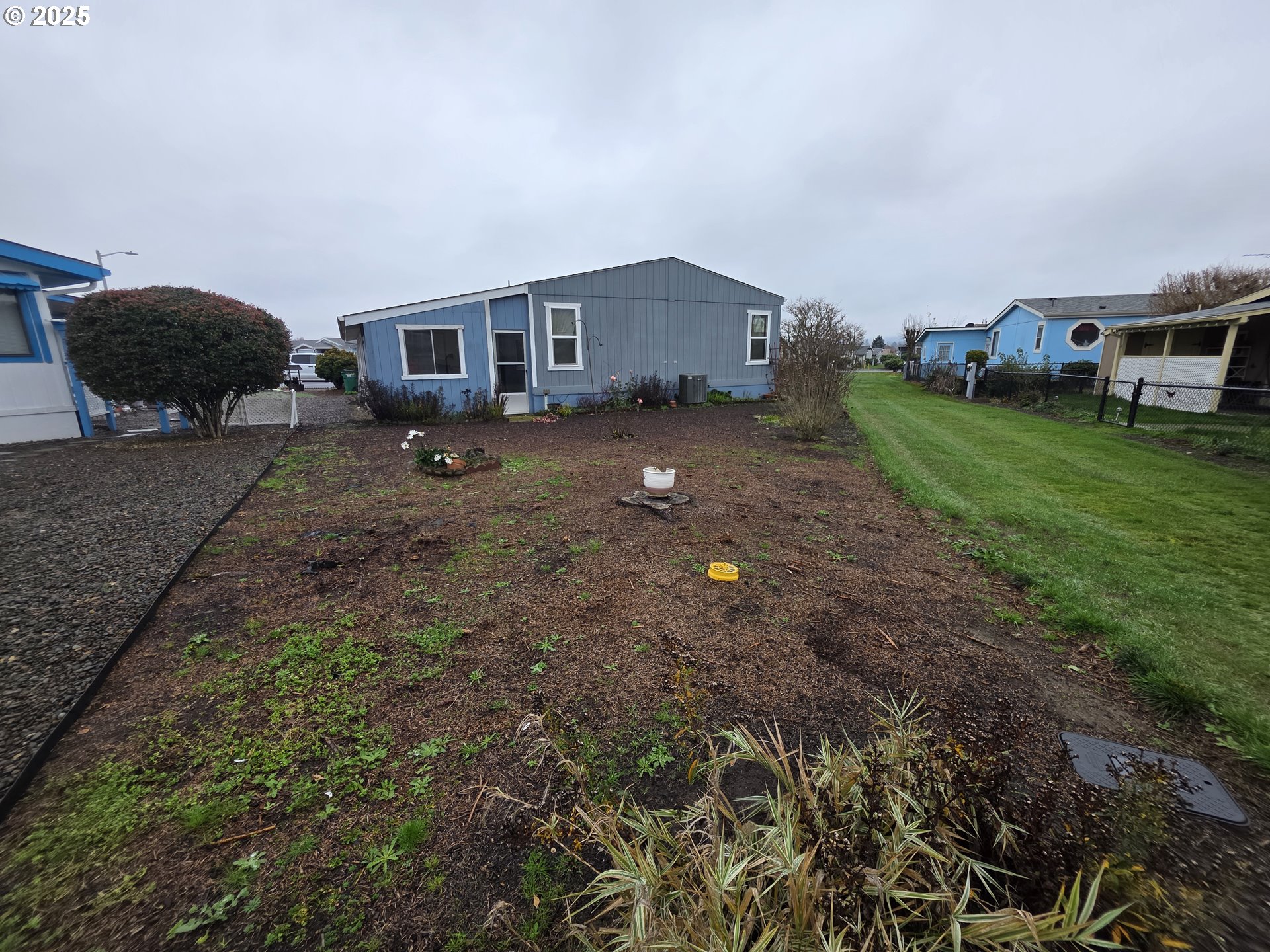 1506 Pioneer Circle Forest Grove, OR 97116 - Photo 23 of 28 a front view of a house with a garden