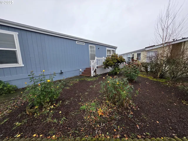 a room with a refrigerator and a window