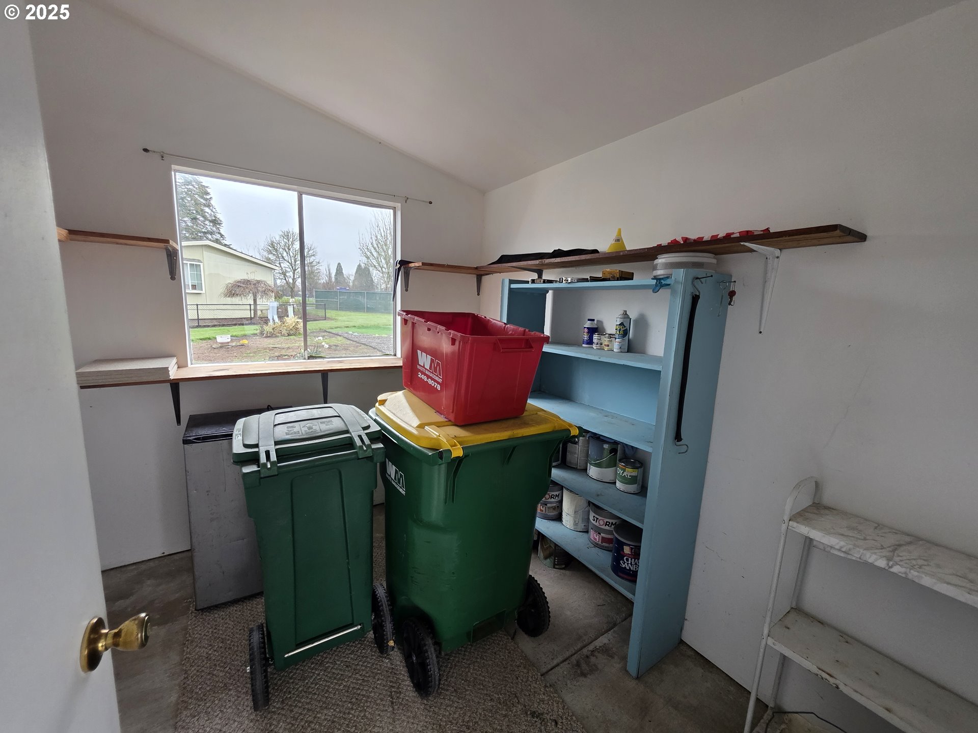 1506 Pioneer Circle Forest Grove, OR 97116 - Photo 27 of 28 a room with a refrigerator and a window