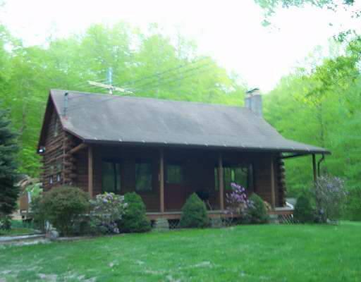 46 Camps Road Kent, CT 06785 - Photo 1 of 1 a view of a house with a yard and potted plants