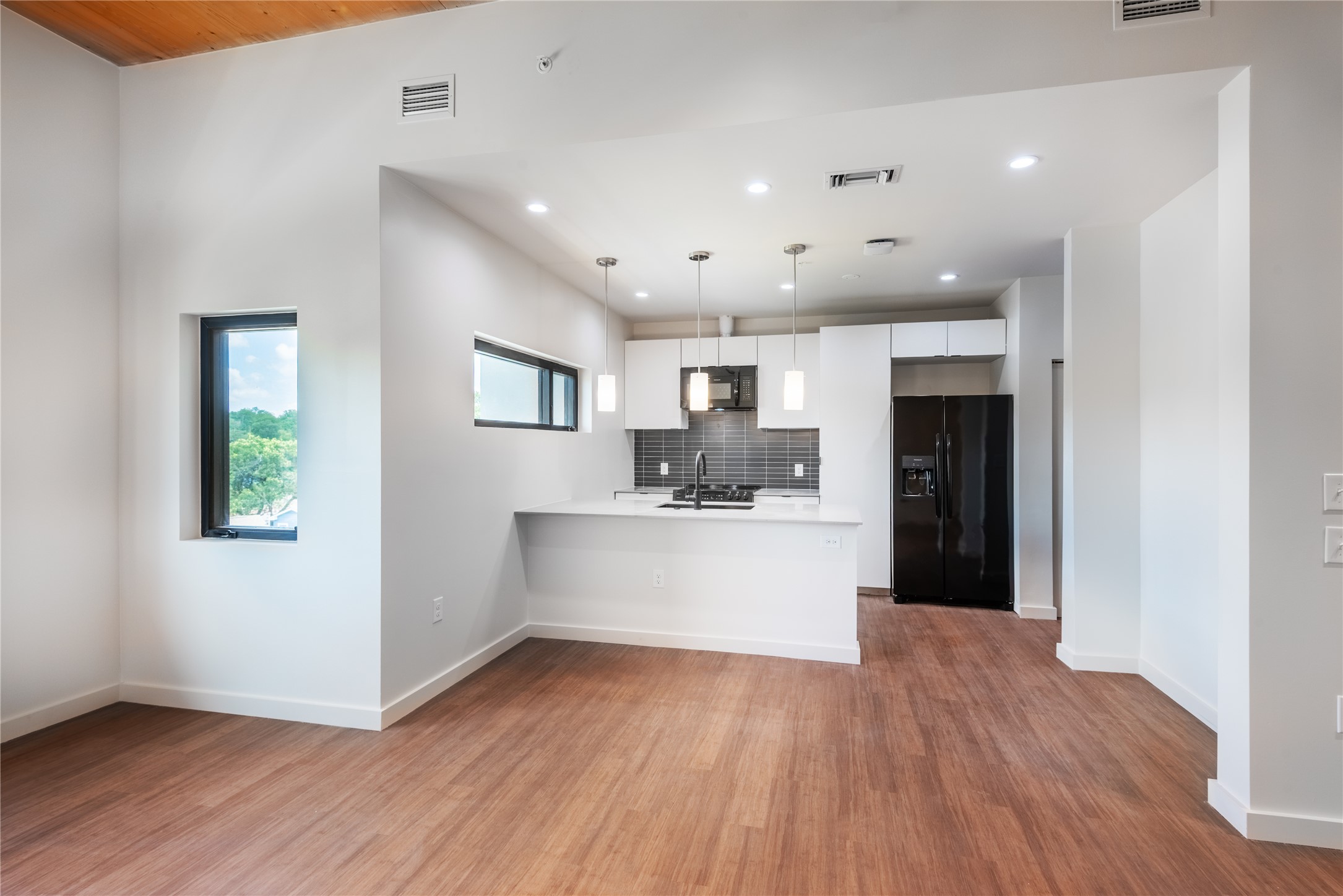 3515 Webberville Road, Unit VISTA Austin, TX 78702 - Photo 3 of 22 a view of kitchen with wooden floor