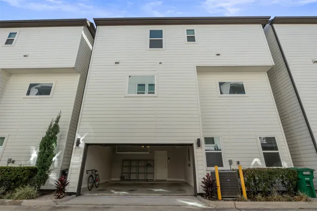 a front view of a house with garage