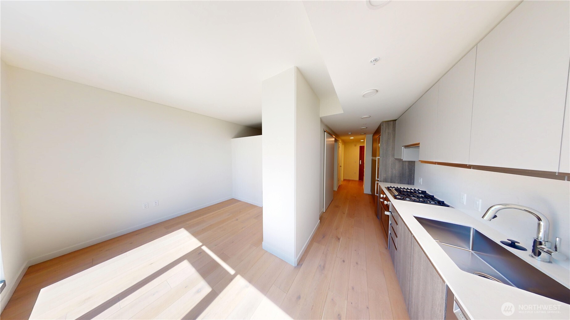 800 Columbia Street, Unit 702 Seattle, WA 98104 - Photo 12 of 15 a view of a hallway with staircase