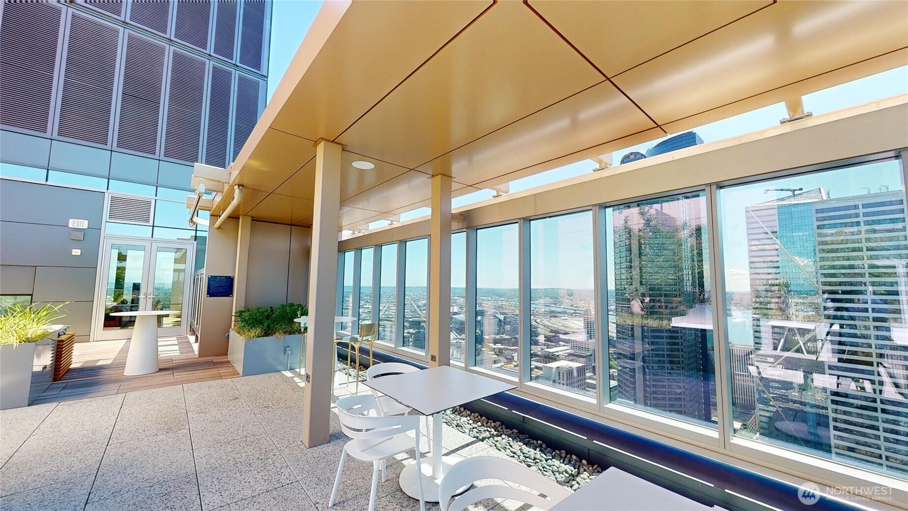 800 Columbia Street, Unit 702 Seattle, WA 98104 - Photo 2 of 15 a living room with furniture