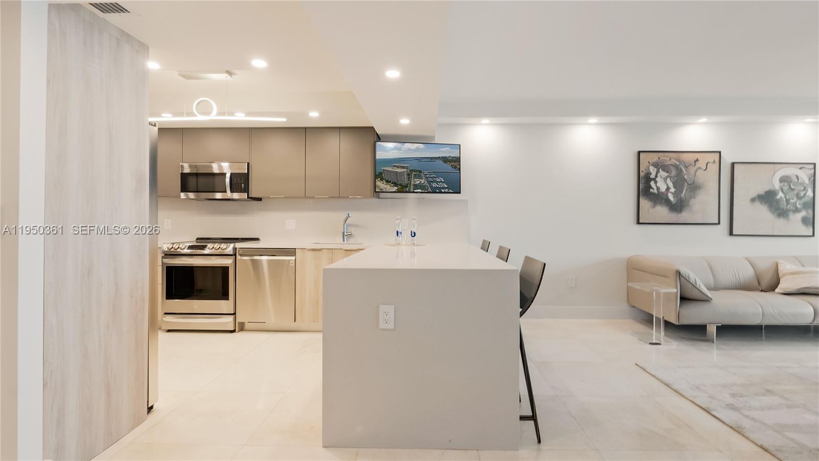 3 Grove Isle Drive, Unit C1407 Miami, FL 33133 - Photo 13 of 45 a living room with furniture and kitchen