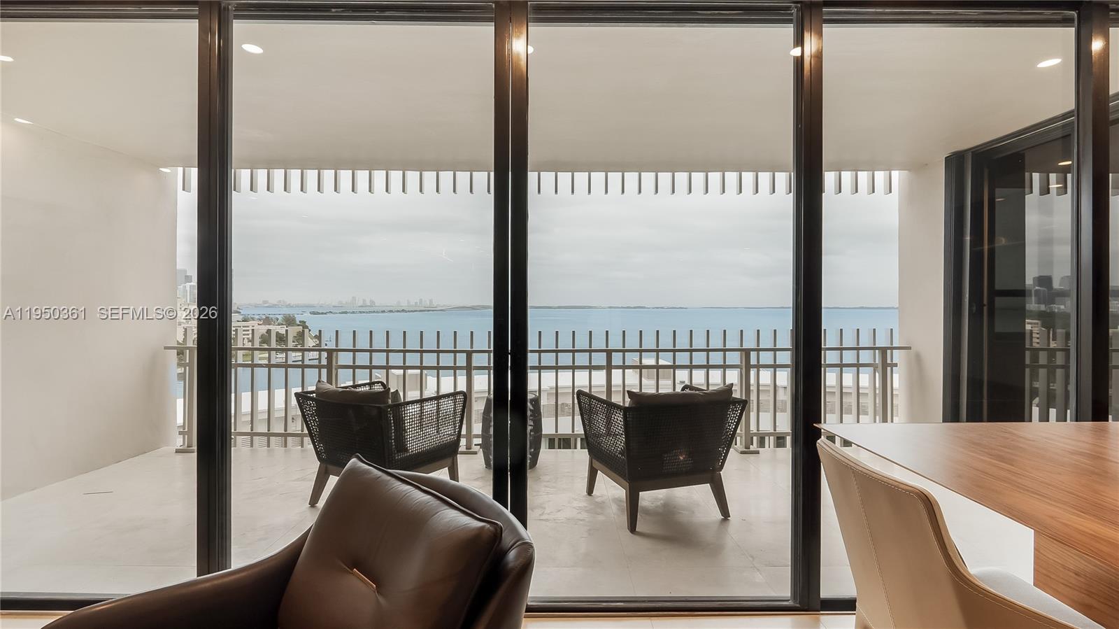 3 Grove Isle Drive, Unit C1407 Miami, FL 33133 - Photo 17 of 45 a view of a balcony with furniture