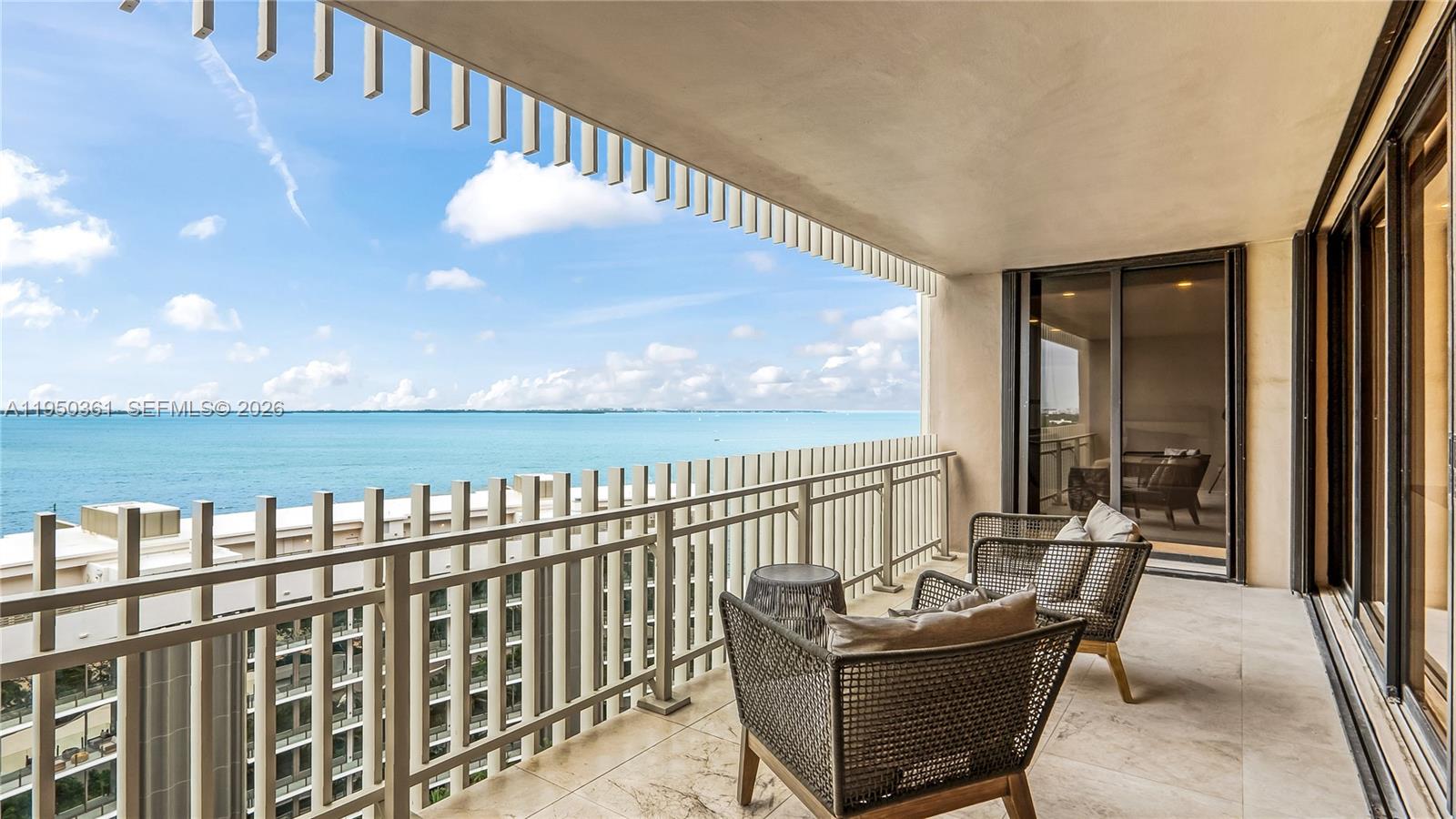 3 Grove Isle Drive, Unit C1407 Miami, FL 33133 - Photo 18 of 45 a balcony with furniture