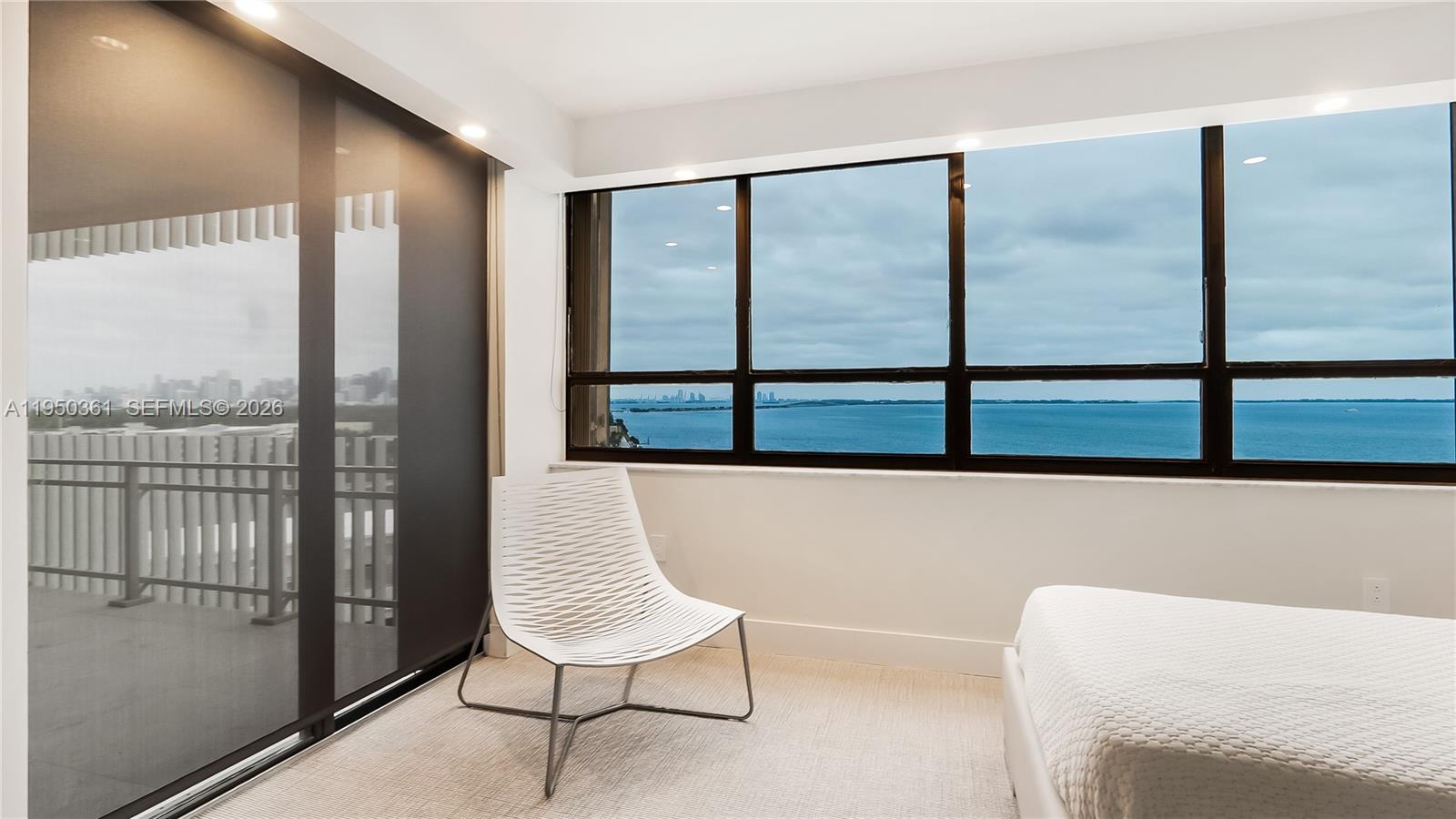 3 Grove Isle Drive, Unit C1407 Miami, FL 33133 - Photo 30 of 45 a balcony view with a couch