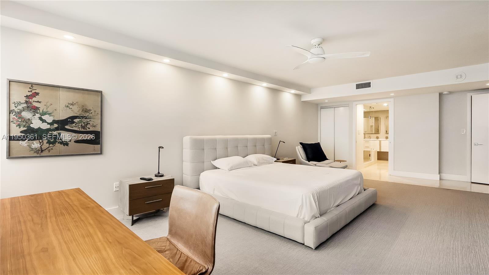 3 Grove Isle Drive, Unit C1407 Miami, FL 33133 - Photo 34 of 45 a bedroom with a bed lamp and a window