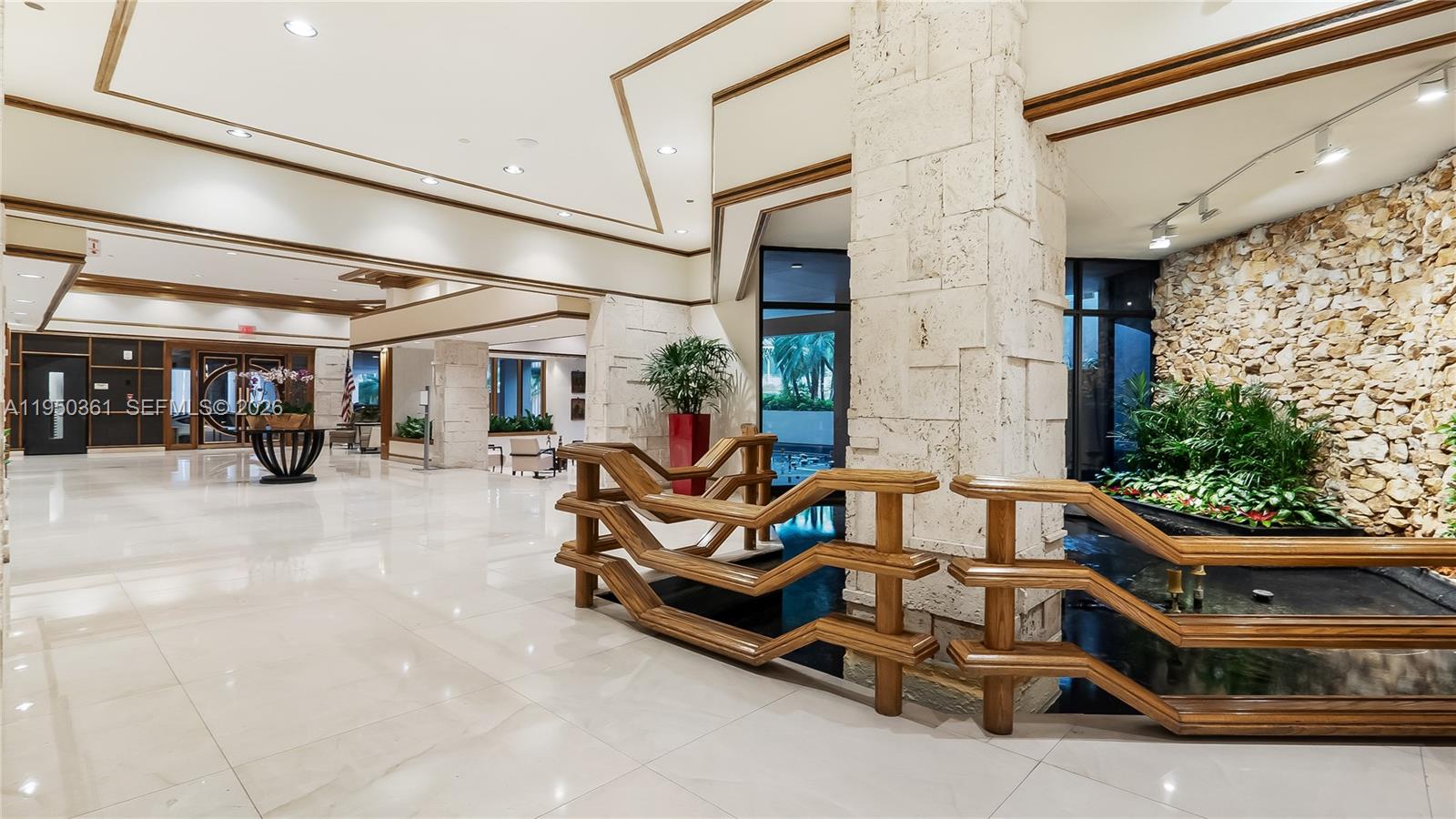 3 Grove Isle Drive, Unit C1407 Miami, FL 33133 - Photo 43 of 45 a view of a chairs in a patio