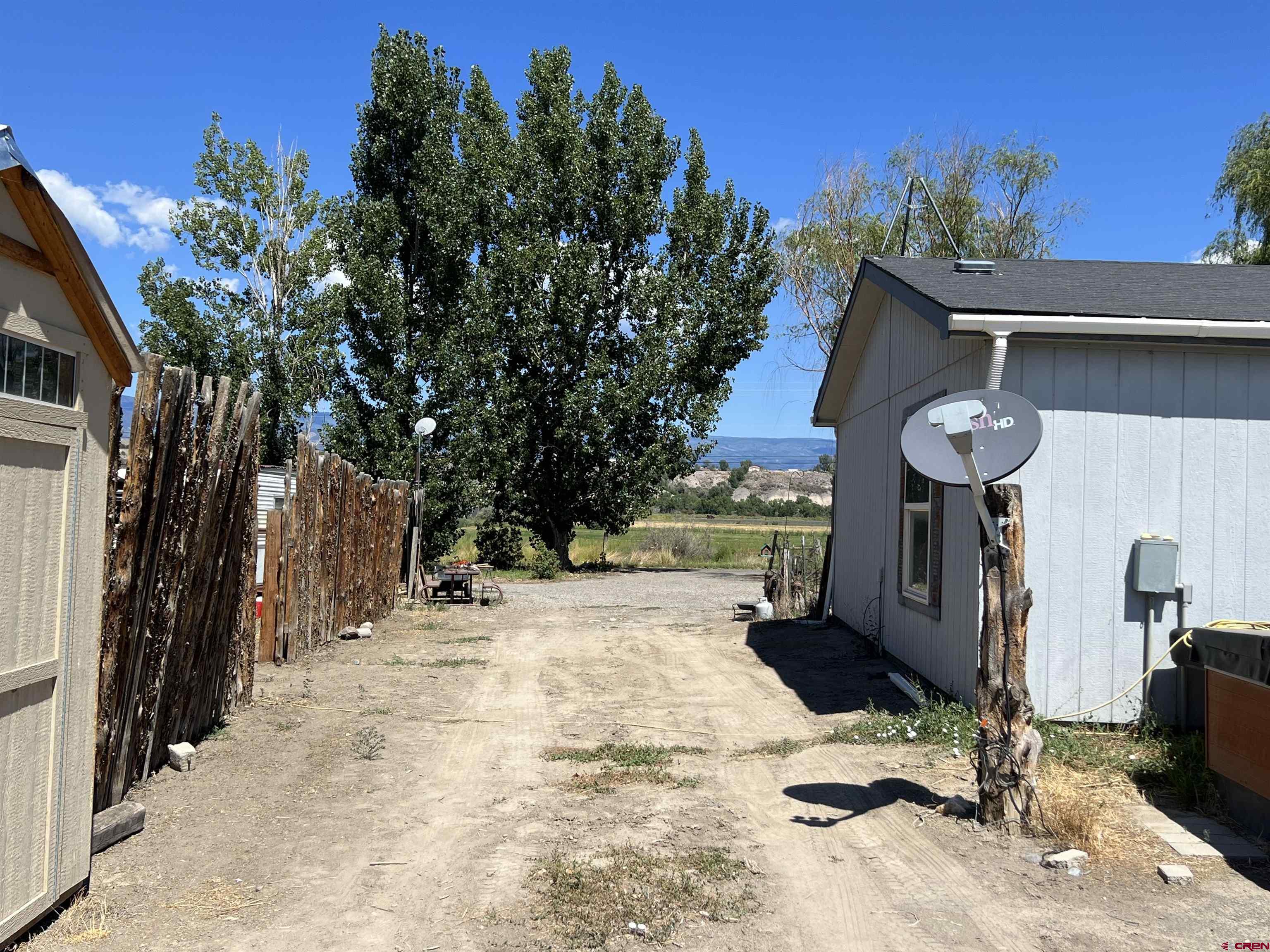 21296 H75 Road Delta, CO 81416 - Photo 25 of 25 a view of a house with a yard