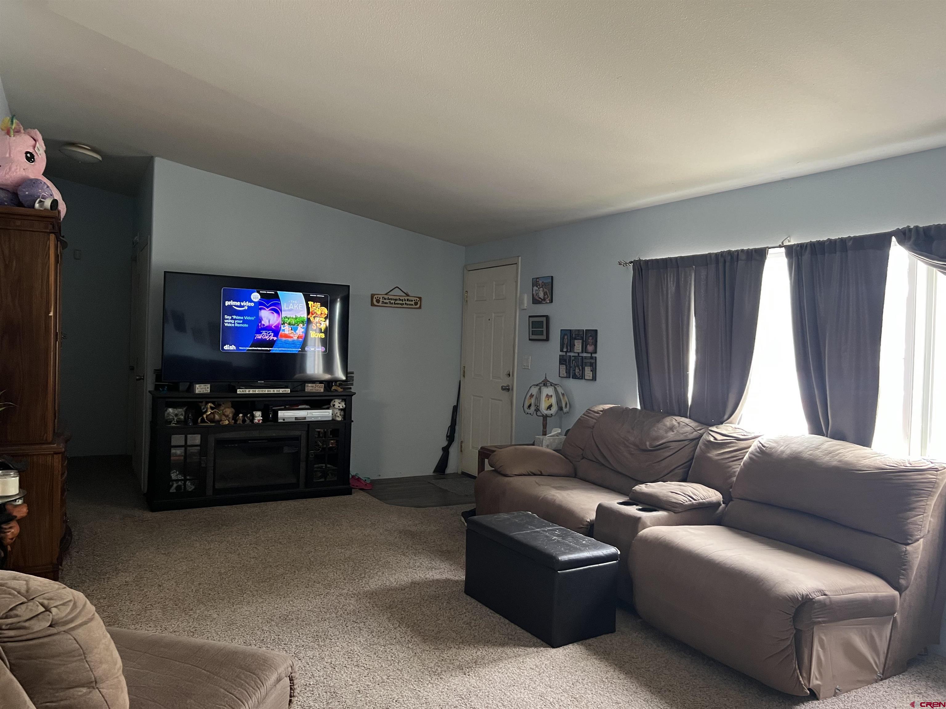 21296 H75 Road Delta, CO 81416 - Photo 5 of 25 a living room with furniture and a flat screen tv