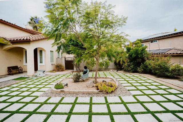 a view of a patio with a table and chairs in patio