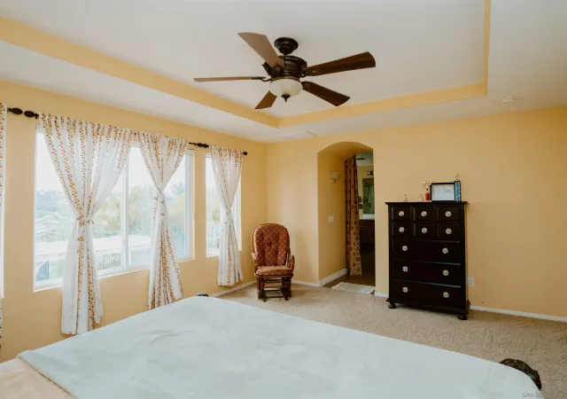 a bed room with a bed and a window