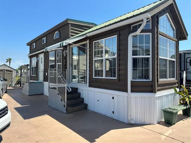 a front view of a house with glass windows