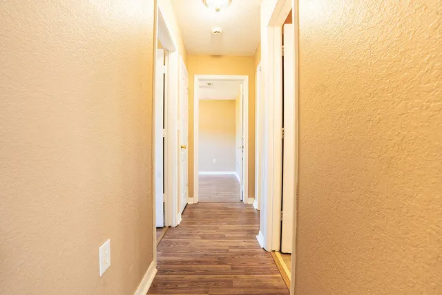 a view of a bathroom from a hallway